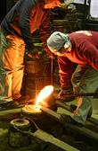 casting(poring the metal into the mold)