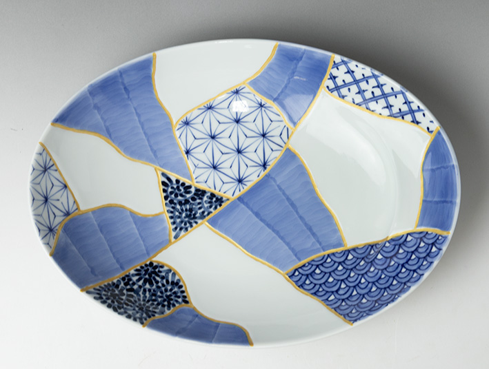Oval bowl with Patchwork of Traditonal Patterns Design -side view